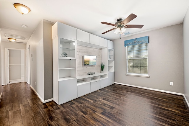 interior space featuring dark wood-type flooring and ceiling fan