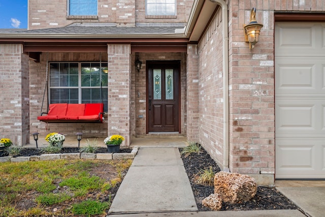 entrance to property featuring a garage