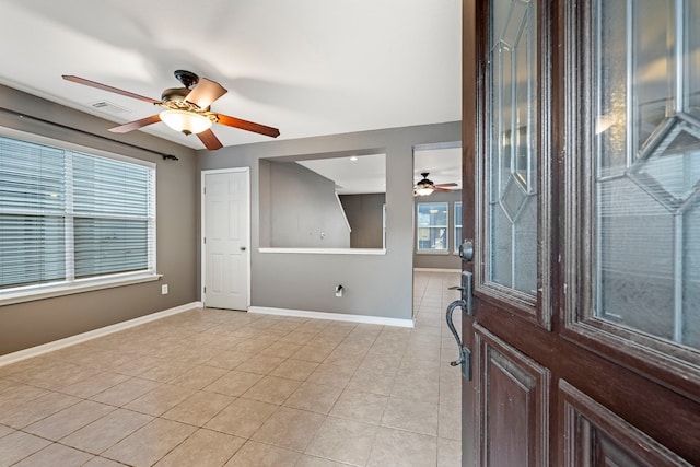 tiled entryway featuring a wealth of natural light