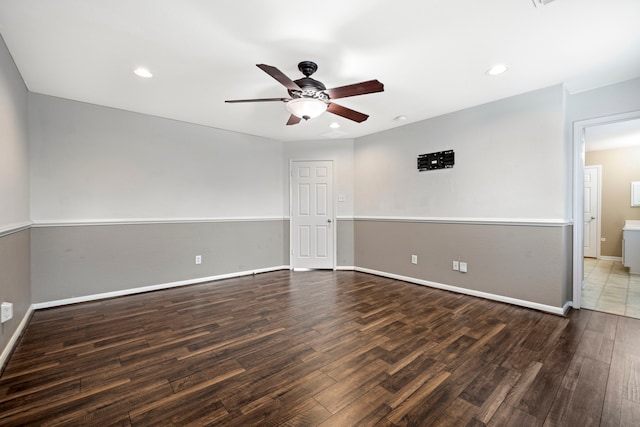 empty room featuring dark hardwood / wood-style floors and ceiling fan