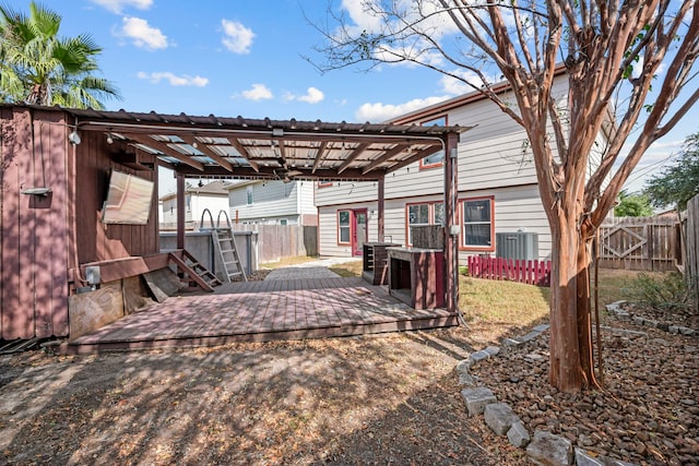 exterior space featuring a deck and a pergola