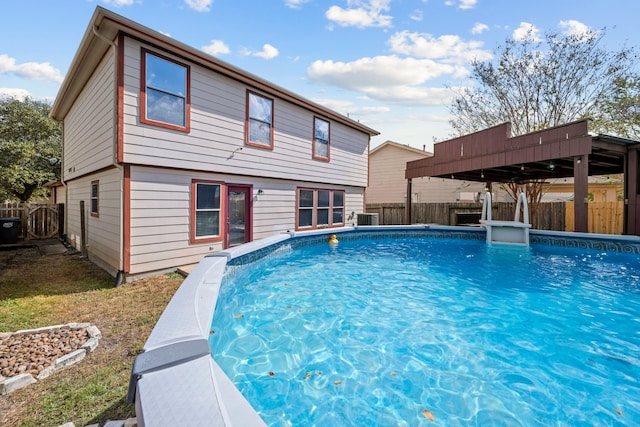 view of pool featuring central AC unit