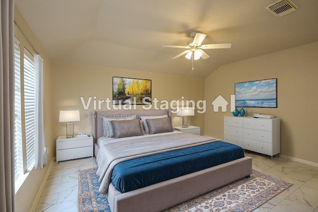 bedroom with lofted ceiling, multiple windows, and ceiling fan