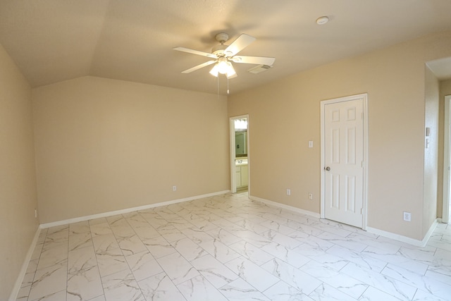 spare room featuring ceiling fan and lofted ceiling