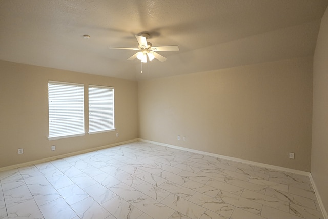 unfurnished room featuring a textured ceiling and ceiling fan