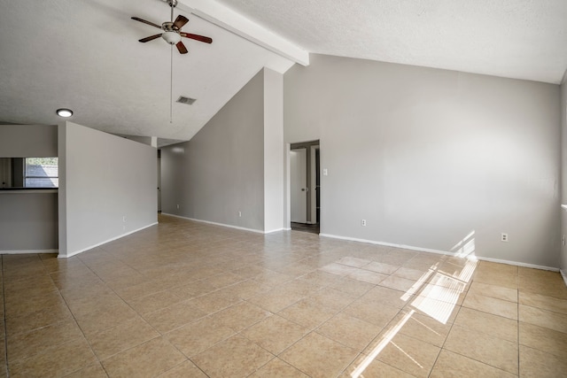 tiled empty room featuring ceiling fan and vaulted ceiling with beams