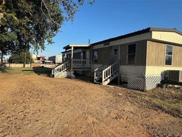 back of property with central air condition unit