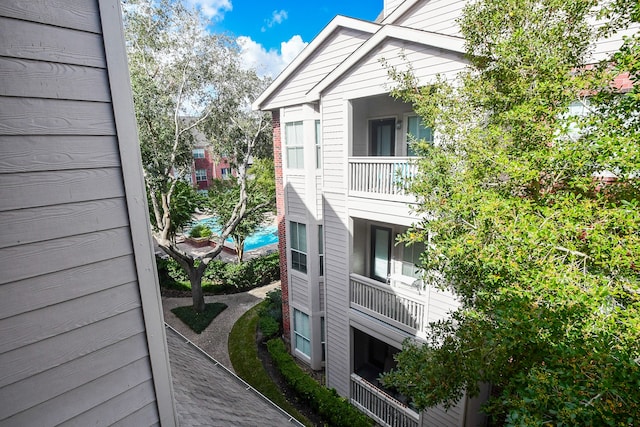 view of home's exterior featuring a balcony