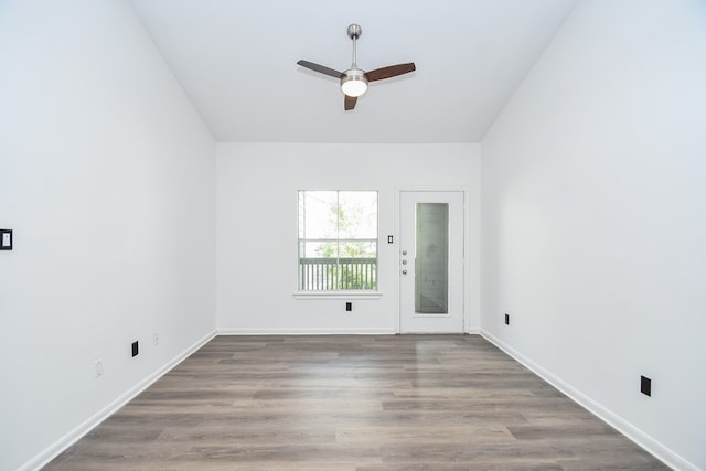 spare room featuring hardwood / wood-style flooring and ceiling fan