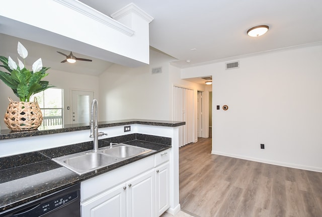 kitchen featuring sink, ceiling fan, light hardwood / wood-style flooring, white cabinets, and black dishwasher