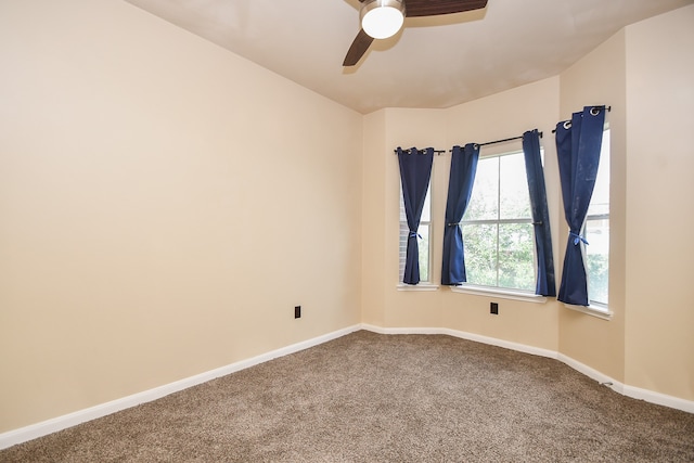 carpeted empty room with ceiling fan