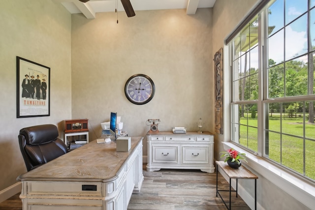 office area featuring beam ceiling, ceiling fan, dark hardwood / wood-style flooring, and a high ceiling