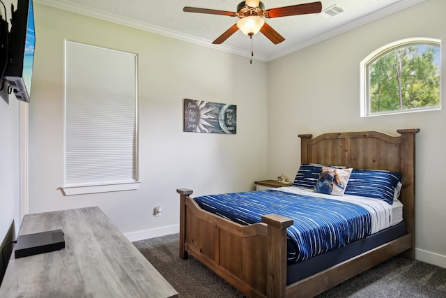 bedroom featuring dark colored carpet, ceiling fan, and ornamental molding