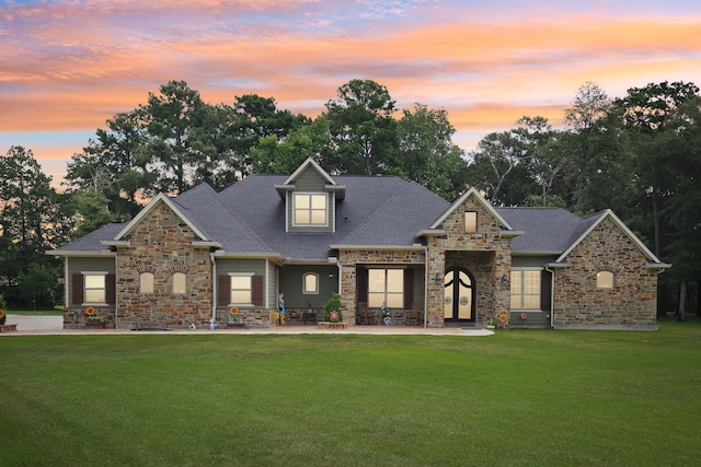 craftsman-style home featuring a yard