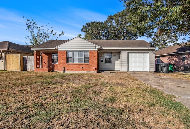 single story home with a front yard and a garage