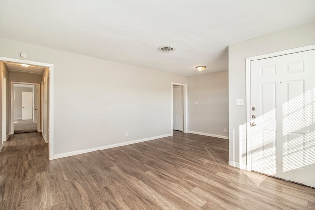 empty room featuring hardwood / wood-style floors