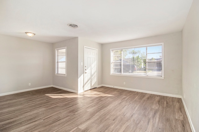 empty room with wood-type flooring