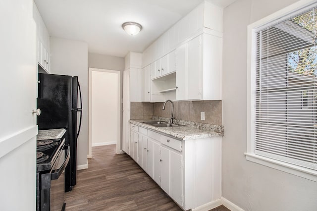 kitchen featuring decorative backsplash, dark wood-type flooring, sink, black range with electric stovetop, and white cabinets