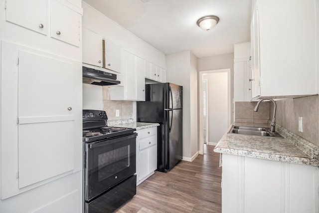 kitchen featuring white cabinets, black appliances, and sink