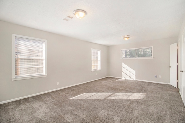 unfurnished room featuring carpet flooring