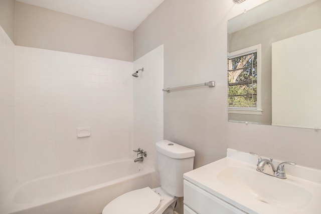 full bathroom featuring toilet, tiled shower / bath, and vanity