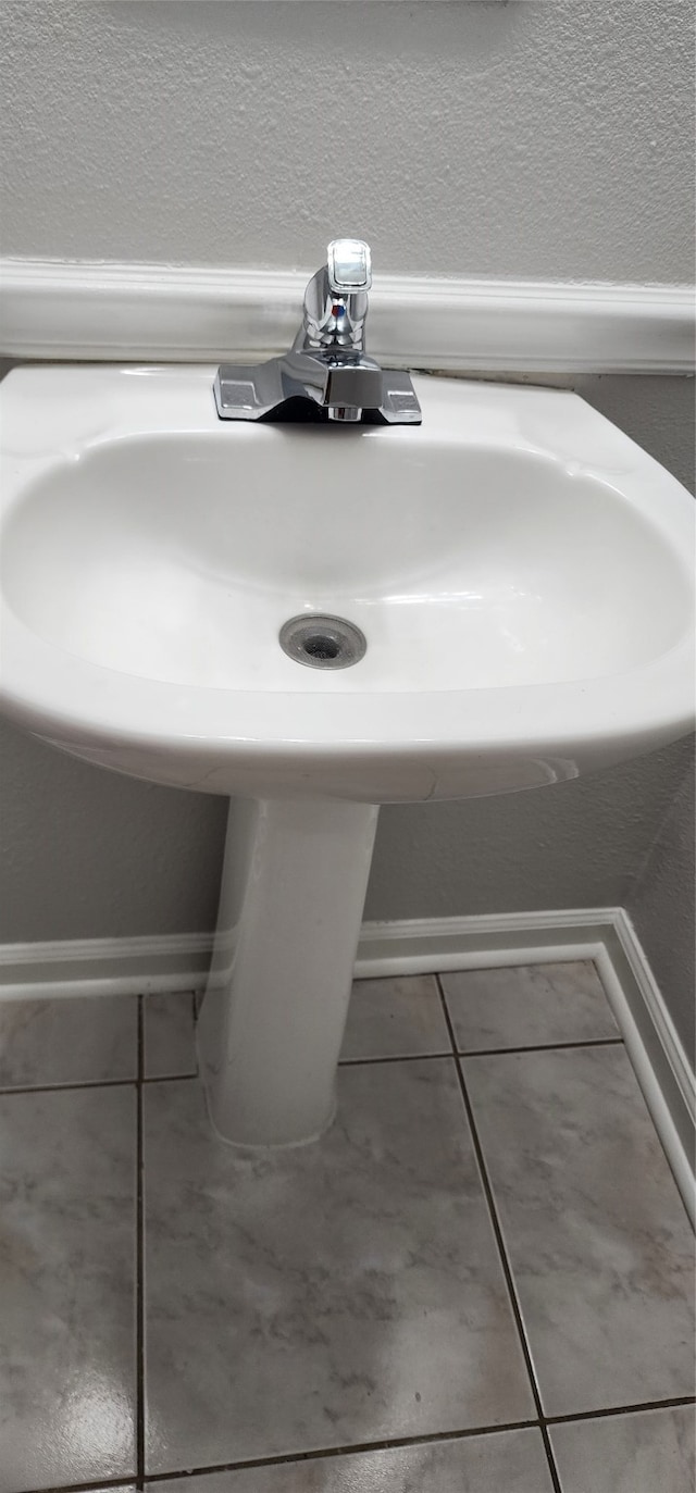 details with sink and tile patterned floors