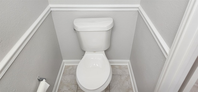 bathroom featuring tile patterned floors and toilet