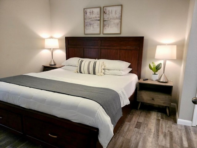 bedroom featuring dark hardwood / wood-style floors