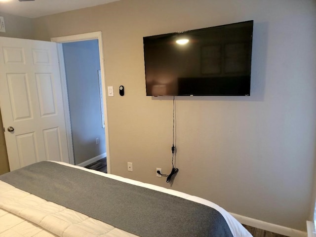 unfurnished bedroom with wood-type flooring