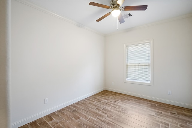 spare room featuring crown molding, light wood-type flooring, and ceiling fan