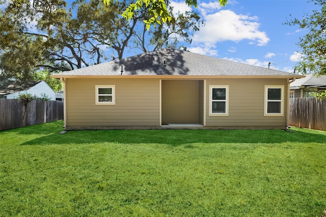 back of property featuring a patio and a lawn