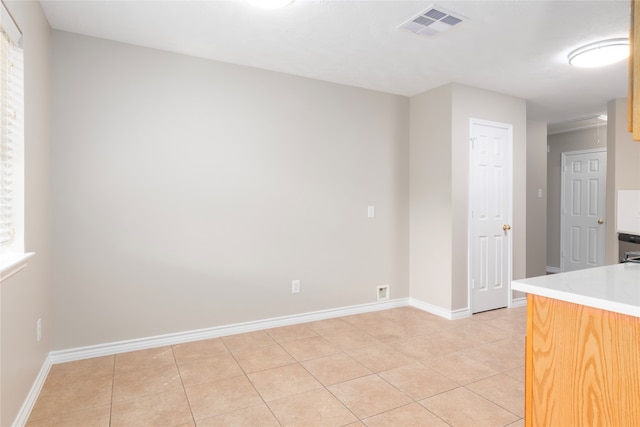 kitchen with light tile patterned flooring