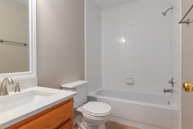 full bathroom featuring vanity, tiled shower / bath combo, toilet, and tile patterned floors