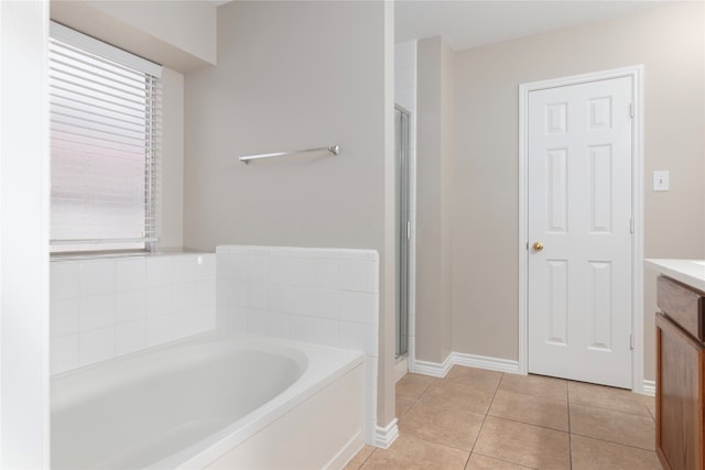 bathroom with vanity, separate shower and tub, and tile patterned flooring