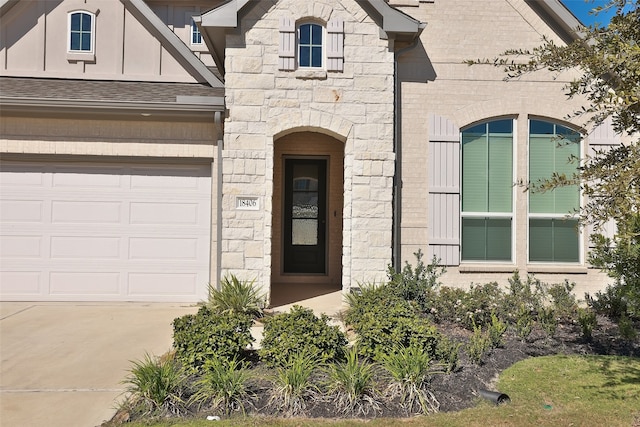 view of exterior entry featuring a garage