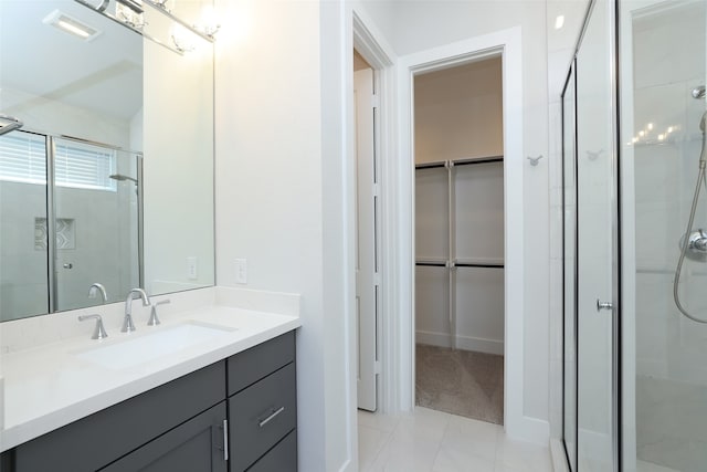 bathroom featuring vanity and a shower with shower door