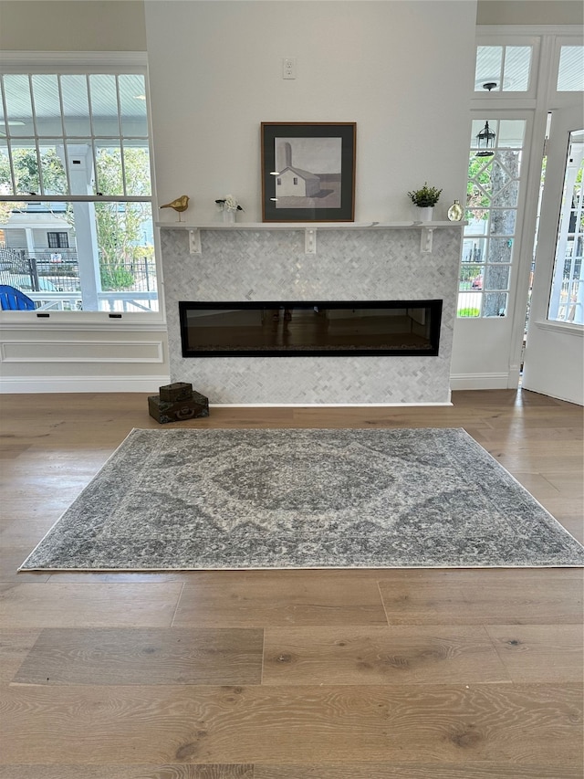 interior space featuring a premium fireplace and hardwood / wood-style floors