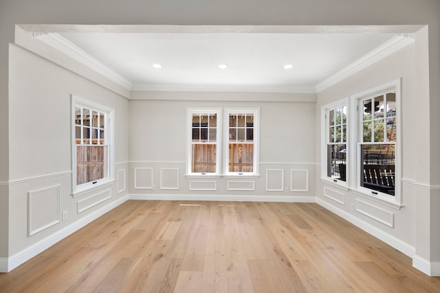 interior space featuring light hardwood / wood-style floors and crown molding