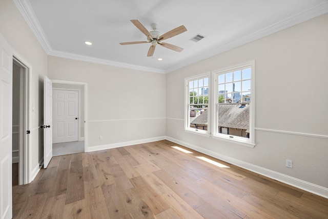 spare room with light hardwood / wood-style floors, ornamental molding, and ceiling fan