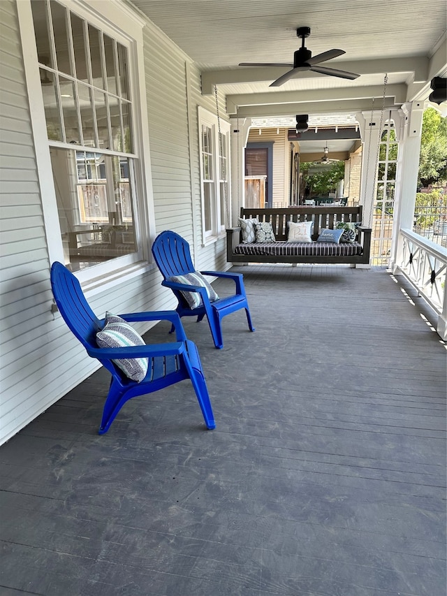 view of patio featuring ceiling fan and a porch