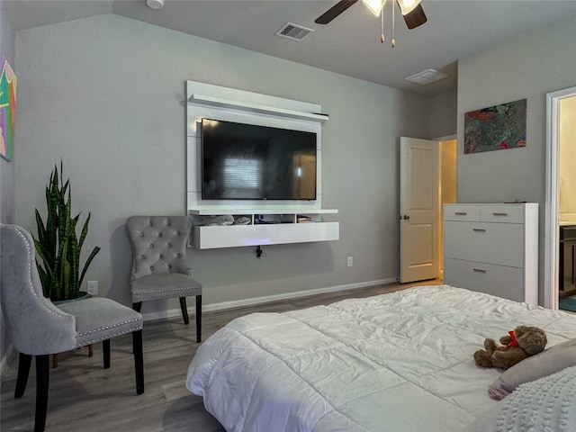 bedroom featuring lofted ceiling, hardwood / wood-style floors, and ceiling fan