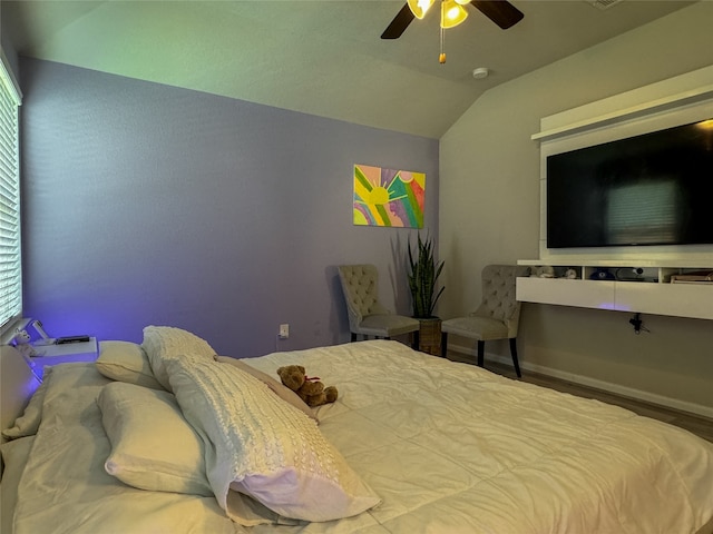 bedroom featuring lofted ceiling and ceiling fan