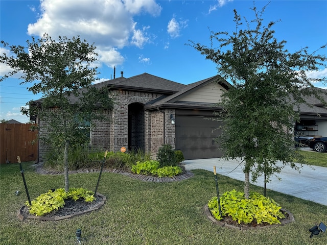 ranch-style house featuring a garage and a front lawn