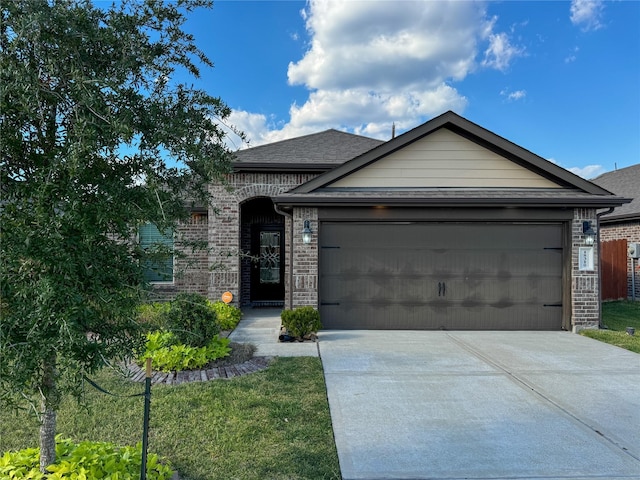 18310 Grayson Bluff Way, Richmond, TX 77407 - view of front facade featuring concrete driveway, an attached garage, and brick siding