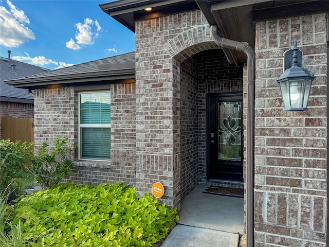 18310 Grayson Bluff Way, Richmond, TX 77407 - doorway to property with brick siding and roof with shingles