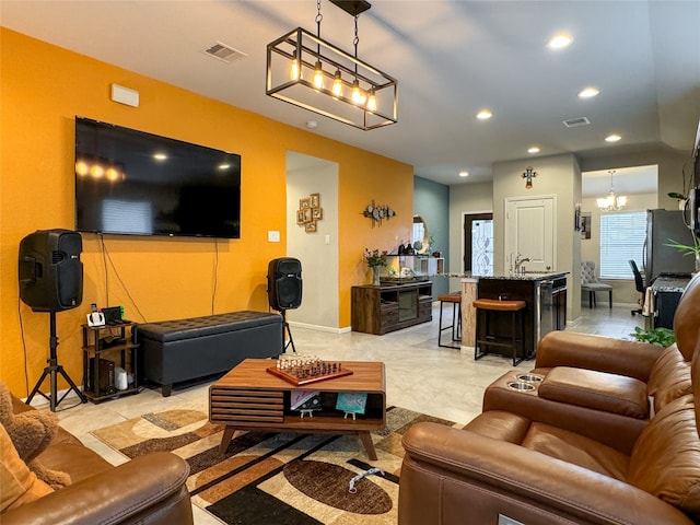 living room with a notable chandelier