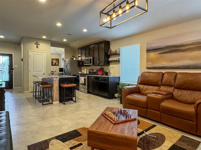 18310 Grayson Bluff Way, Richmond, TX 77407 - living area featuring recessed lighting, baseboards, and light tile patterned floors