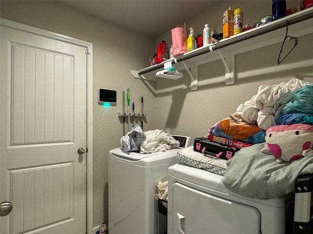 washroom with independent washer and dryer