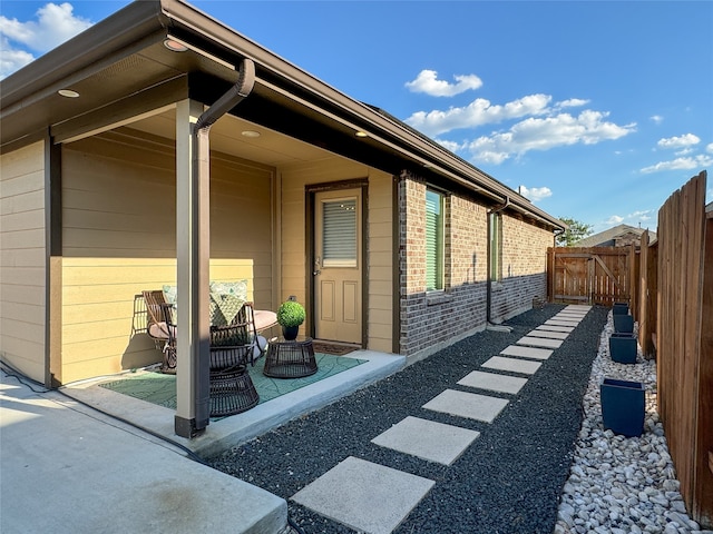 view of side of home with a patio area