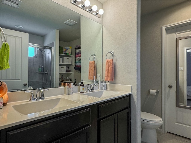 18310 Grayson Bluff Way, Richmond, TX 77407 - full bathroom with a stall shower, toilet, and double vanity